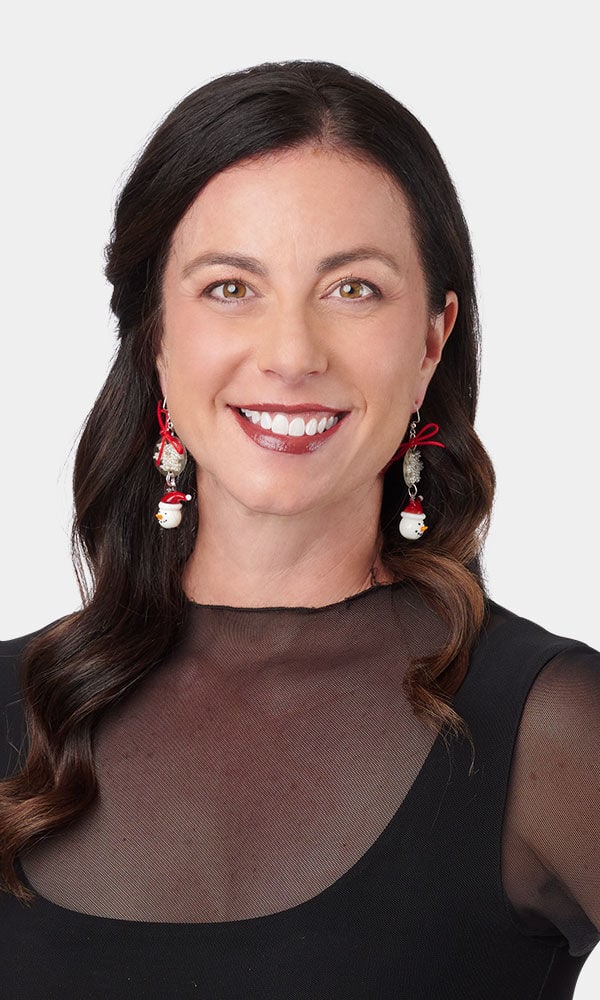 Model wearing metalworking earrings